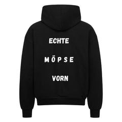 Unisex oversized zipper hoodie with "Echte Möpse vorn" text, 100% cotton, black.